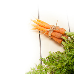 Image showing baby carrots bunch tied with rope