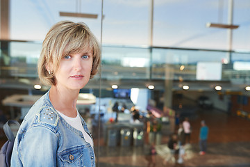 Image showing Woman with backpack going on boarding