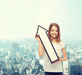 Image showing smiling little girl with blank arrow pointing up