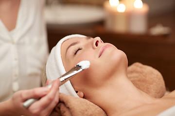 Image showing close up of young woman and cosmetologist in spa