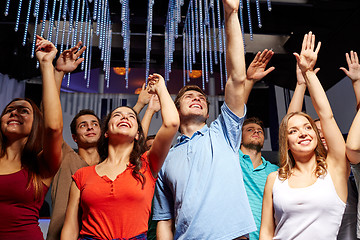 Image showing group of smiling friends at concert in club