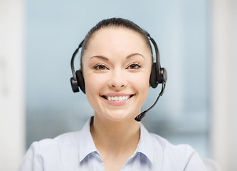 Image showing female helpline operator with headphones