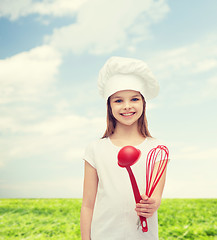 Image showing smiling girl in cook hat with ladle and whisk