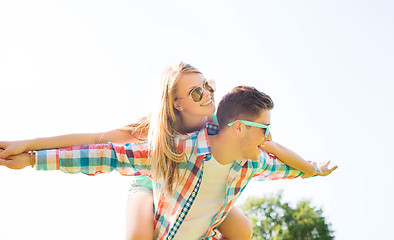 Image showing smiling couple having fun in park