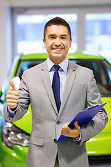 Image showing man showing thumbs up at auto show or car salon