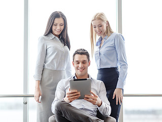 Image showing business team working with tablet pc in office