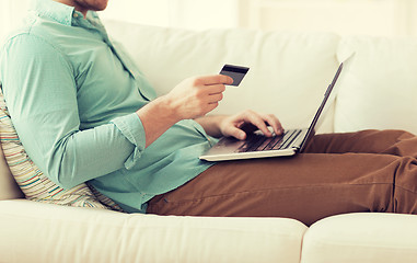 Image showing close up of man with laptop and credit card