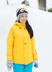 Image showing happy young woman in ski goggles outdoors