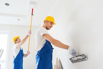 Image showing group of builders with tools indoors