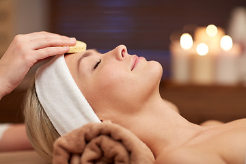 Image showing close up of woman having face cleaning in spa