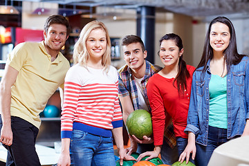 Image showing happy friends in bowling club