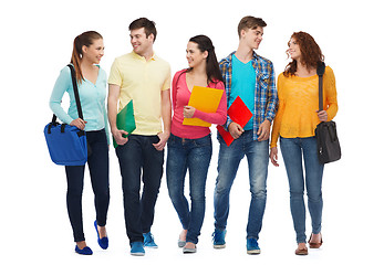Image showing group of smiling teenagers with folders and bags