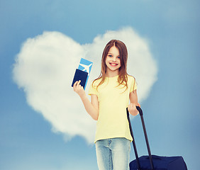 Image showing smiling girl with travel bag ticket and passport