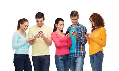 Image showing group of smiling teenagers with smartphones