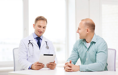 Image showing doctor with tablet pc and patient in hospital