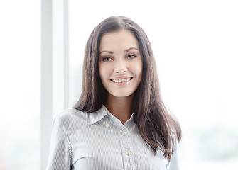 Image showing happy businesswoman in office