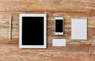 Image showing close up of notebook, tablet pc and smartphone
