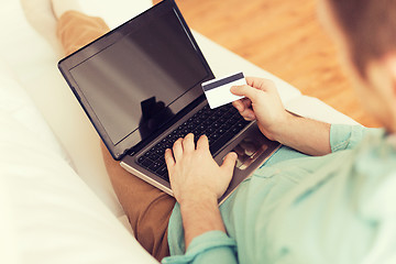 Image showing close up of man with laptop and credit card