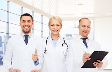 Image showing group of doctors showing thumbs up in clinic