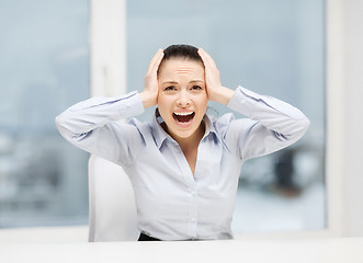 Image showing angry screaming businesswoman in office