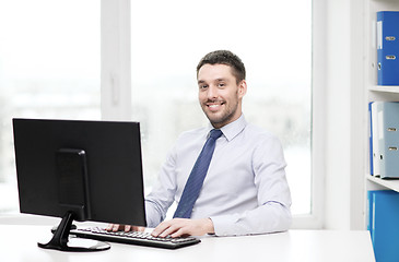 Image showing smiling businessman or student with computer