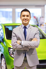 Image showing happy man at auto show or car salon