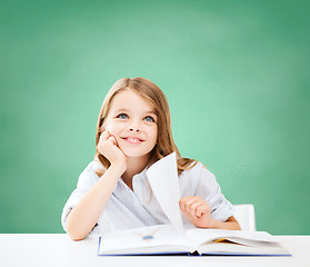 Image showing happy student girl with book at school