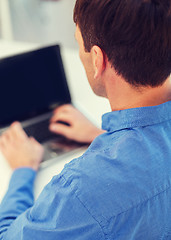 Image showing close up of man with laptop computer