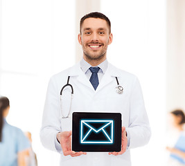 Image showing smiling male doctor with tablet pc