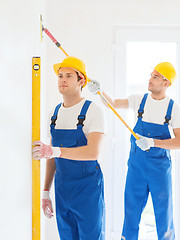 Image showing group of builders with tools indoors