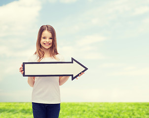 Image showing smiling girl with blank arrow pointing right