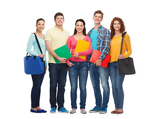 Image showing group of smiling teenagers with folders and bags