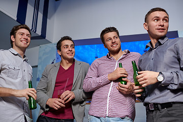 Image showing group of male friends with beer in nightclub