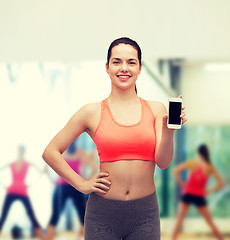 Image showing sporty woman with smartphone