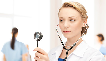 Image showing young female doctor with stethoscope