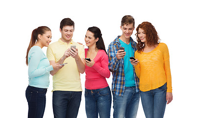 Image showing group of smiling teenagers with smartphones