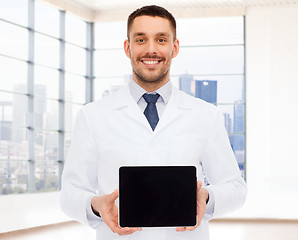Image showing smiling male doctor with tablet pc