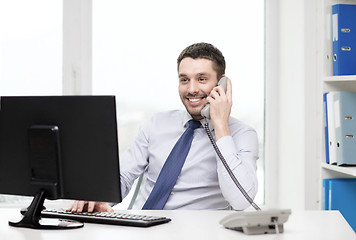 Image showing smiling businessman or student with computer