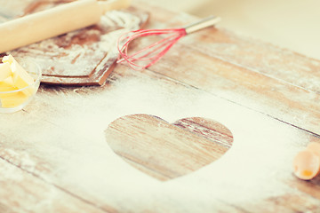 Image showing close up of heart of flour on wooden table at home