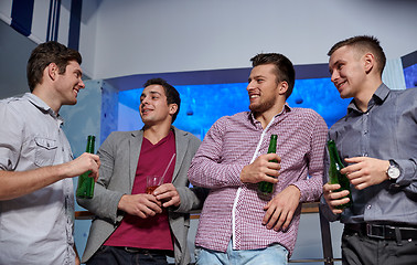 Image showing group of male friends with beer in nightclub