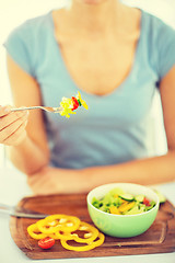 Image showing woman hand holding fork with vegetables