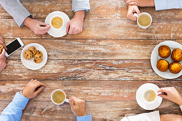 Image showing close up of business team drinking coffee on lunch