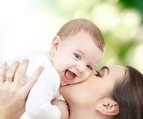 Image showing laughing baby playing with mother