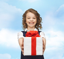 Image showing happy smiling girl with gift box