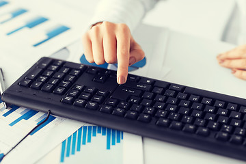 Image showing woman hand pressing enter button on keyboard