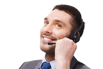 Image showing close up of smiling businessman with smartphone