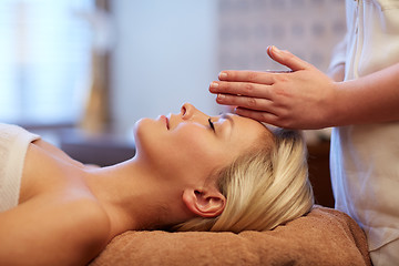 Image showing close up of woman having face massage in spa