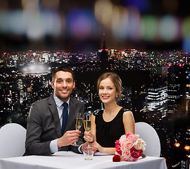 Image showing couple with glasses of champagne at restaurant