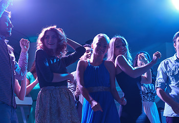 Image showing group of happy friends dancing in night club