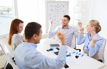 Image showing smiling business people meeting in office